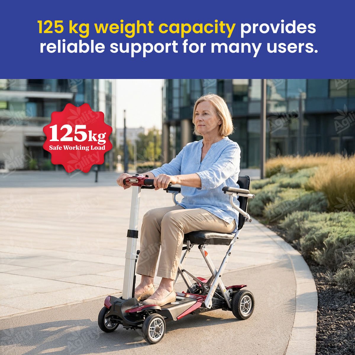 Woman using a mobility scooter with a 125 kg weight capacity label in an urban setting.