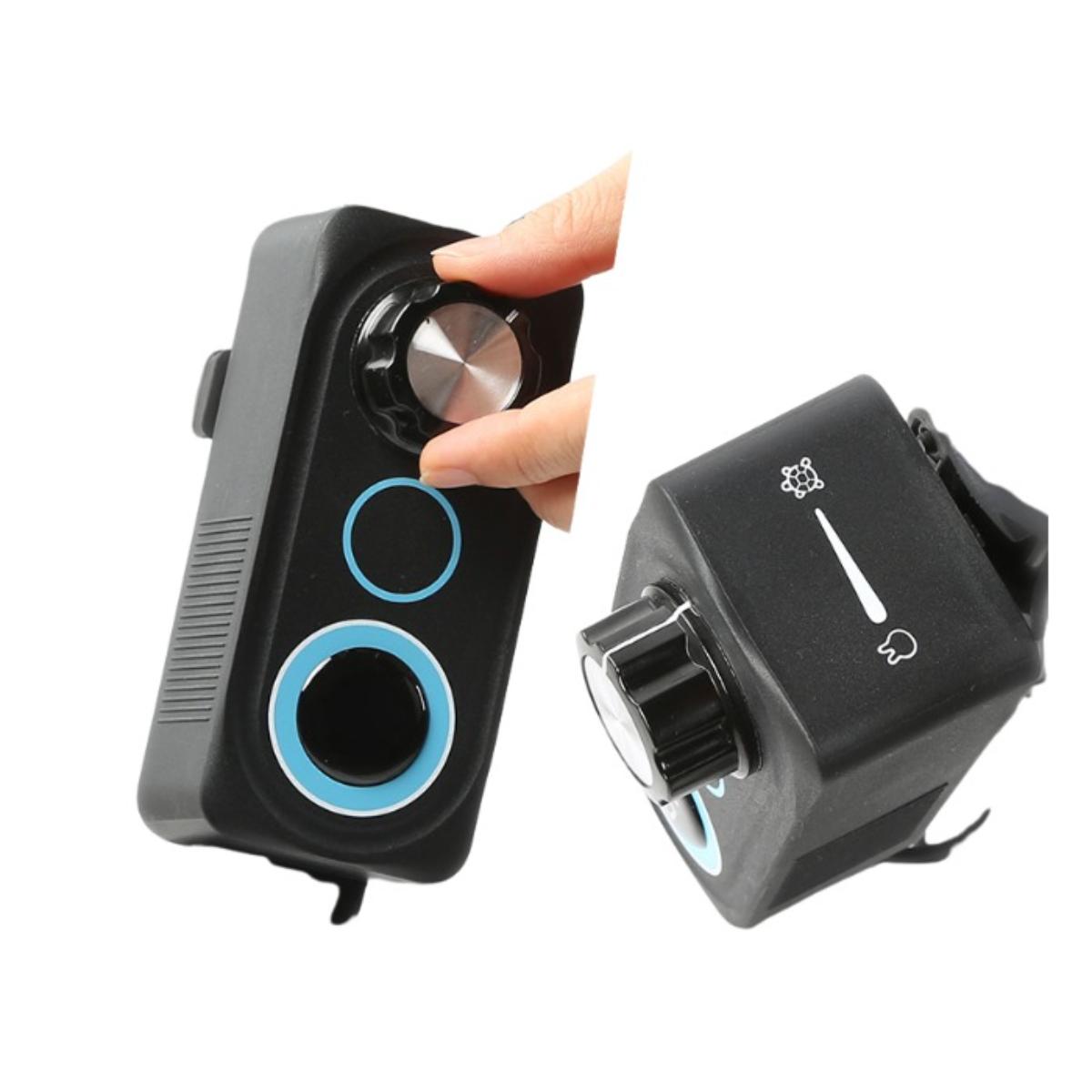 Two black electronic devices with buttons and a hand holding one of them on a white background.