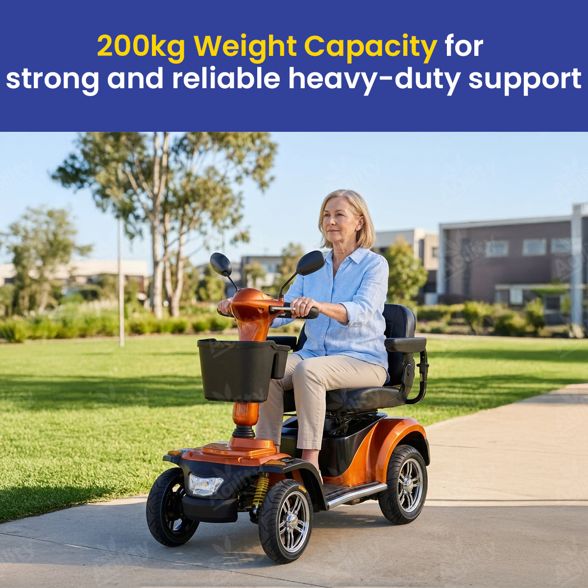 Woman using a Emperor  mobility scooter with text about weight capacity in an outdoor setting.