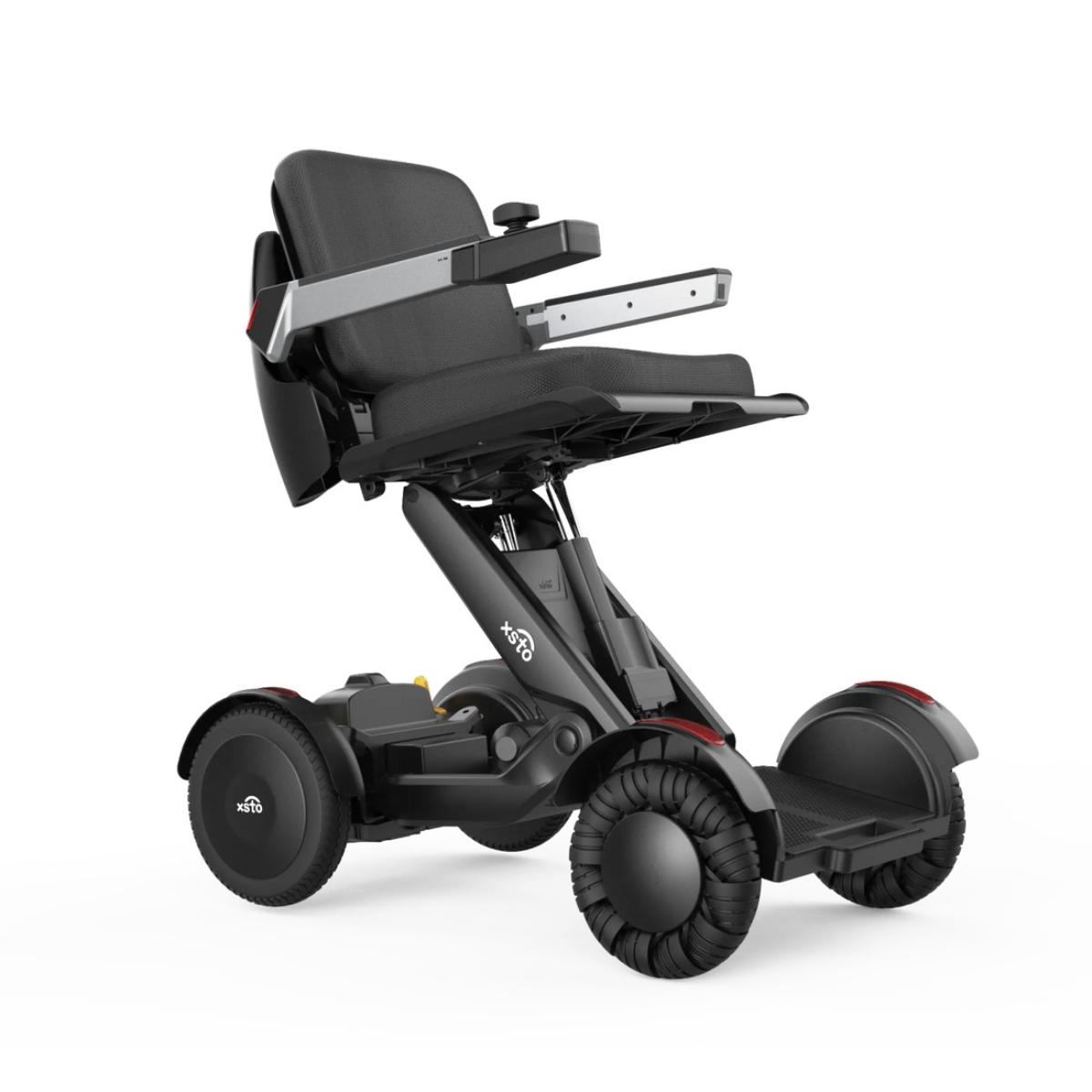 Black M4 Power wheelchair with a seat on a white background