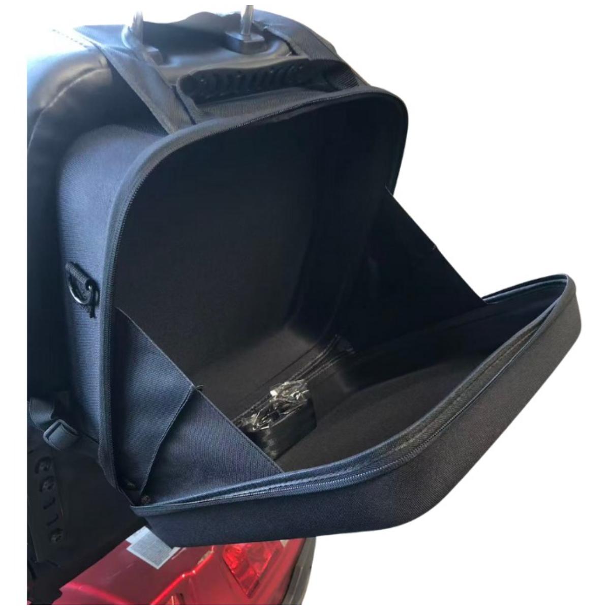 Black Mobility scooter seat bag attached to a motorcycle with a clear plastic window.