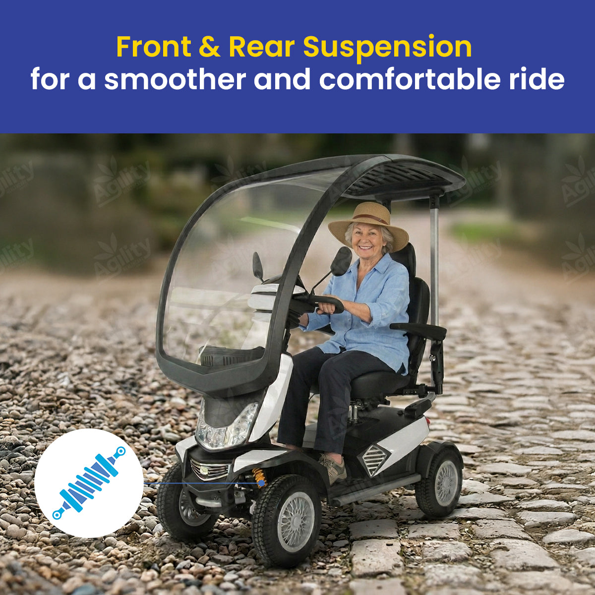 Woman using a safari mobility scooter with front and rear suspension on a cobblestone path.